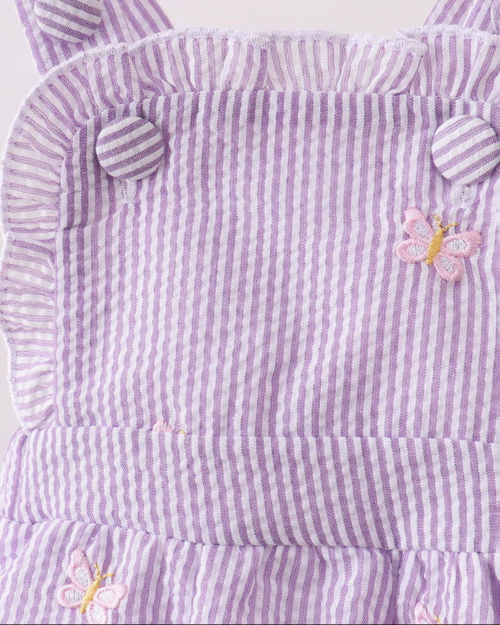 Purple and white striped dress with butterfly designs on a white background