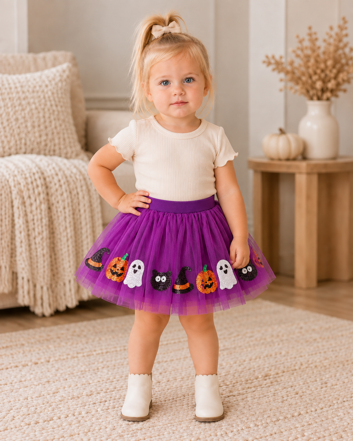 Purple tulle tutu skirt on child, with Halloween pumpkin, ghost, and witch-hat sequins
