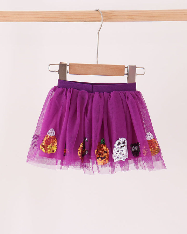 Purple sequin tutu skirt with multiple pumpkin and ghost appliques across the hem