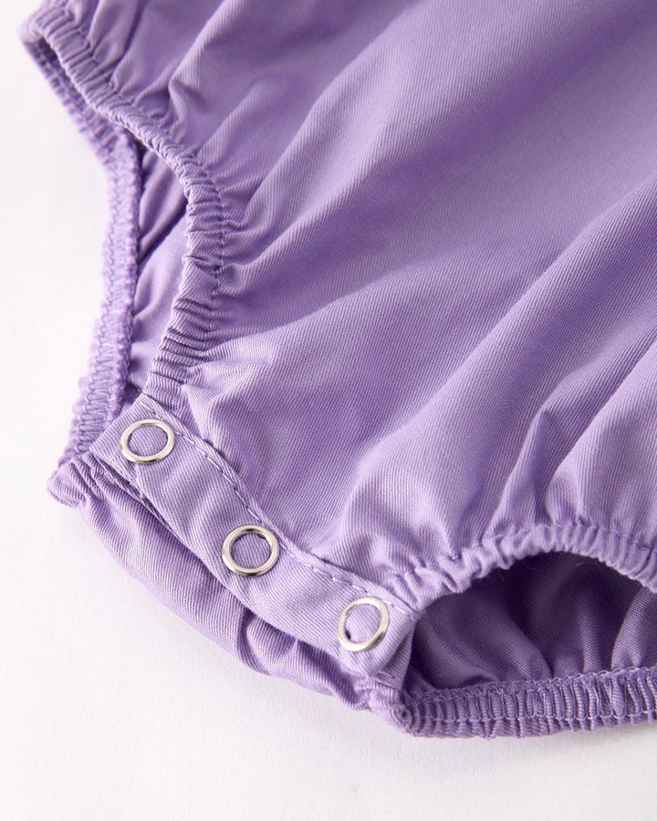 Lavender short romper leg with adjustable snap placket and gathered elastic hem