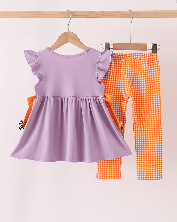 Lilac ruffle top with spider graphics and orange gingham pants set
