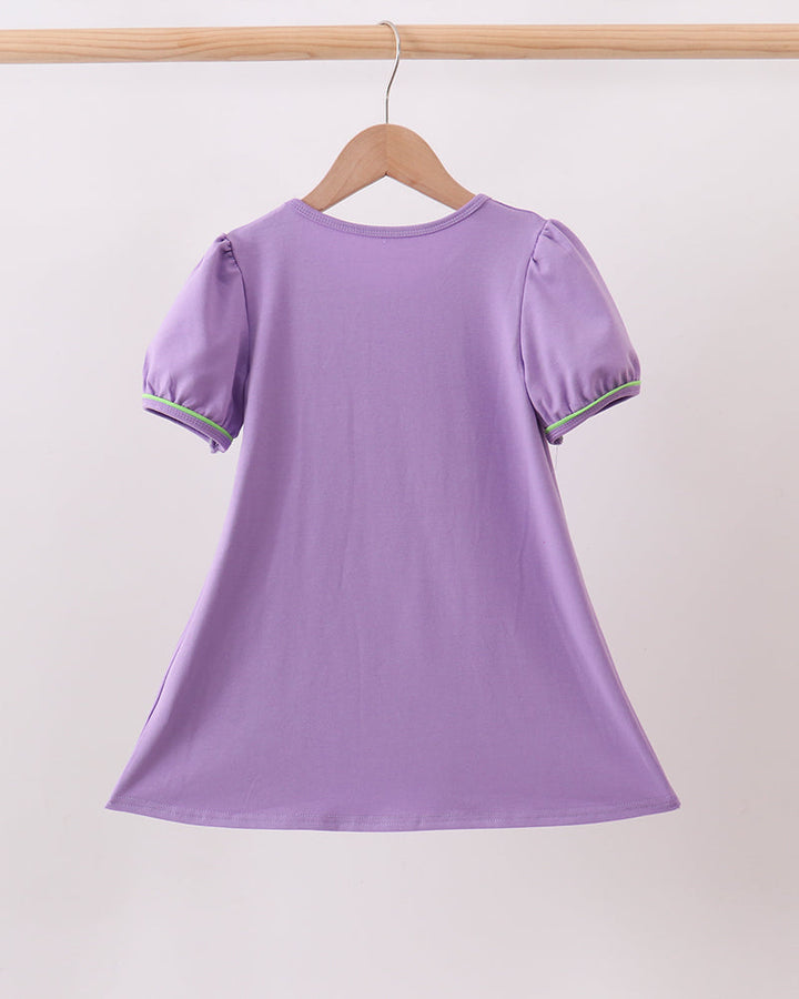 Purple witch dress with puff sleeves and green trim