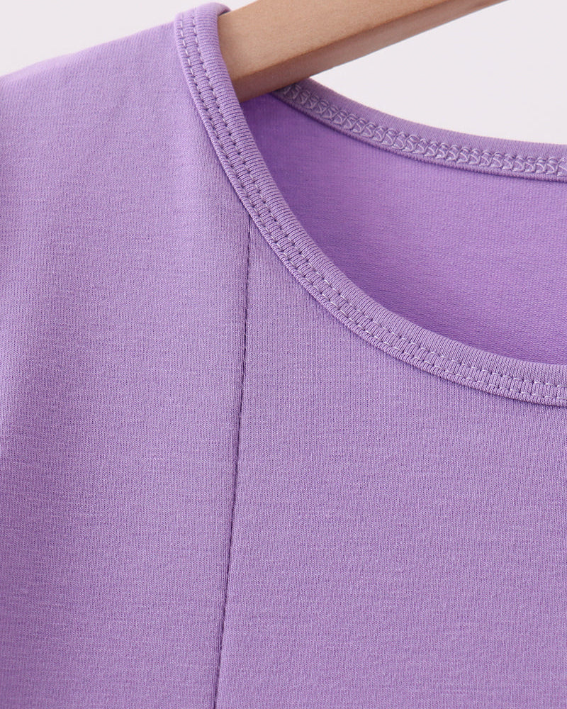 Purple crew-neck dress with stitched collar and green-trimmed sleeve edge