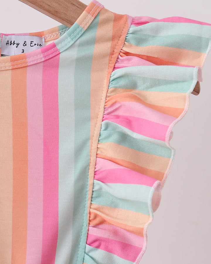 Colorful striped top with ruffled edges on a plain background
