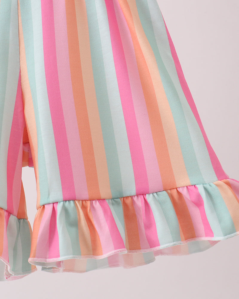 Pastel striped dress with ruffled hem on a light background