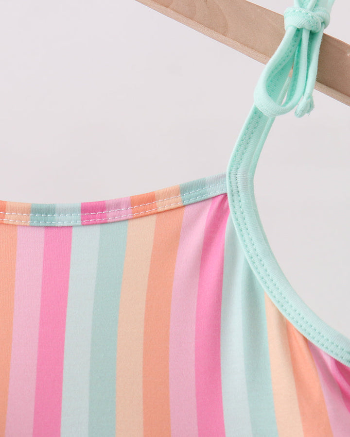Colorful striped dress with a green strap on a white background