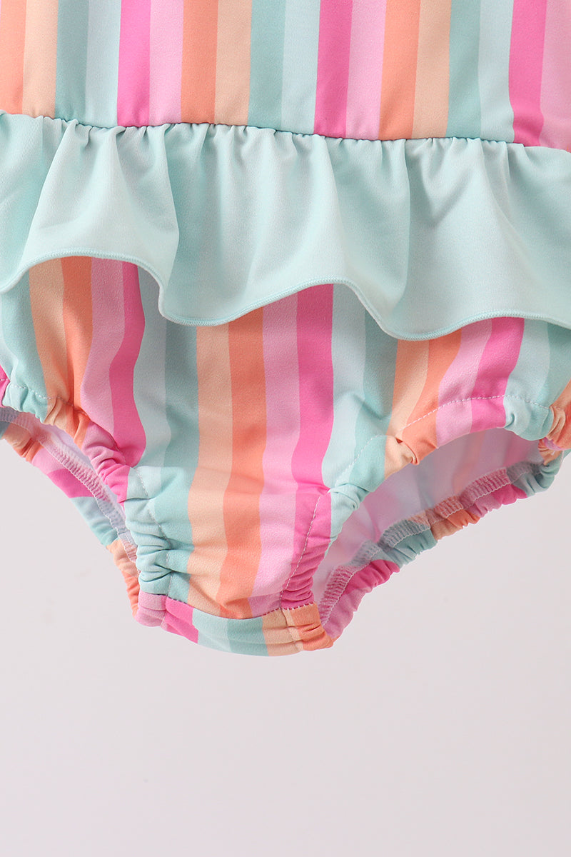 Colorful striped baby bloomers on a light gray background