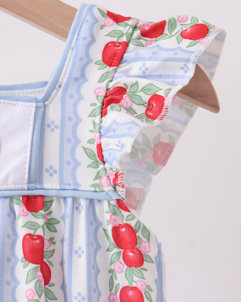 Light blue romper with red apple pattern on a white background