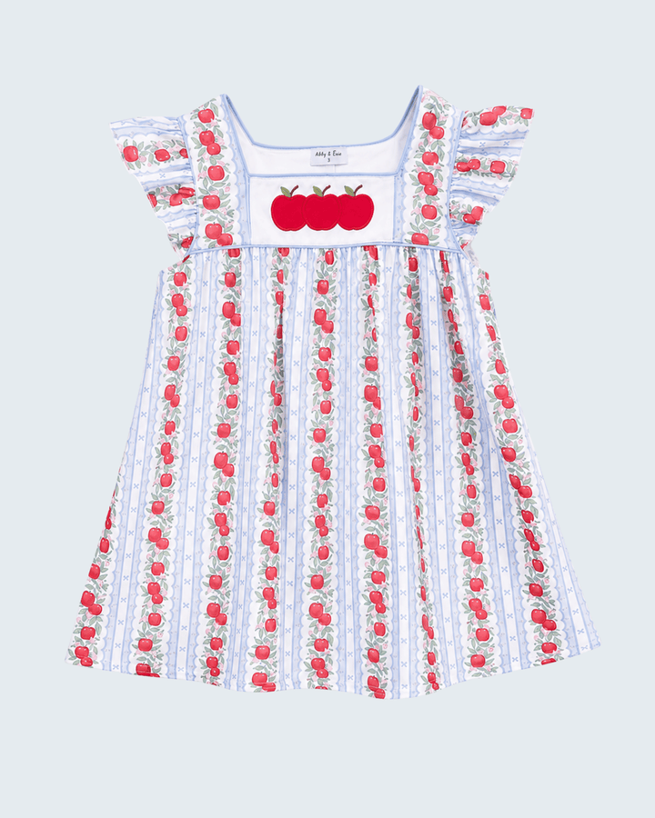 Dress with apple pattern on a light gray background