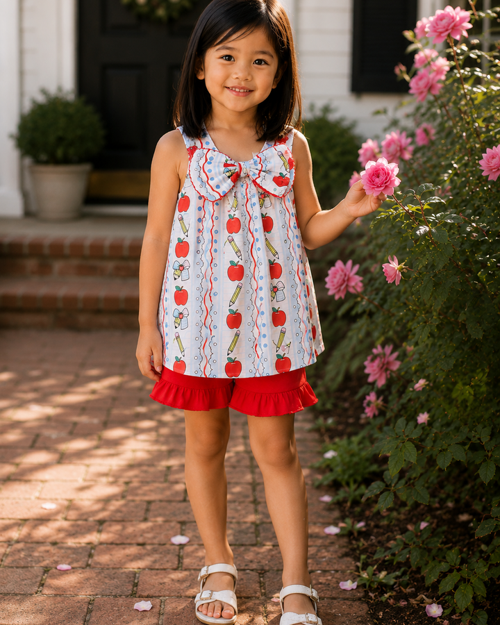 Girls sleeveless apple print ruffle dress with red trim and matching red shorts