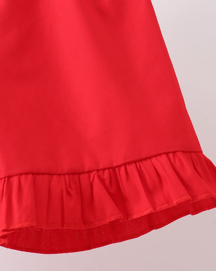 Red fabric shorts with gathered waist and ruffled hem