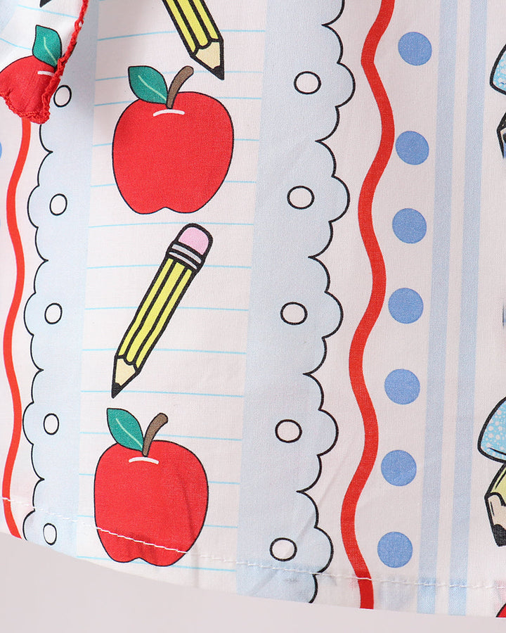 Apple and pencil print top fabric with scalloped ruffle edge