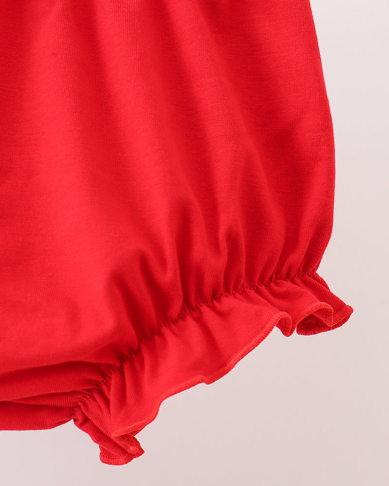 Red bloomer shorts with elastic cuffs and gathered ruffle hem