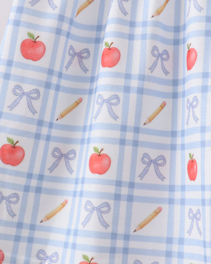 Girls light blue dress fabric with red apples, blue bows, and candy cane icons
