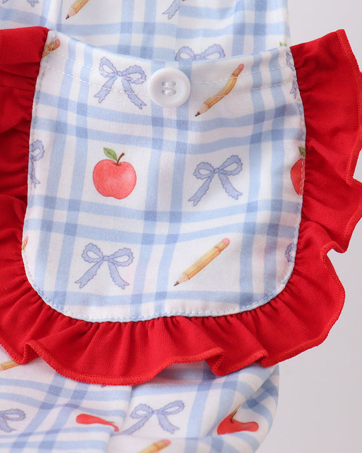 Front buttoned yoke with red ruffle trim; apple and bow print on blue check