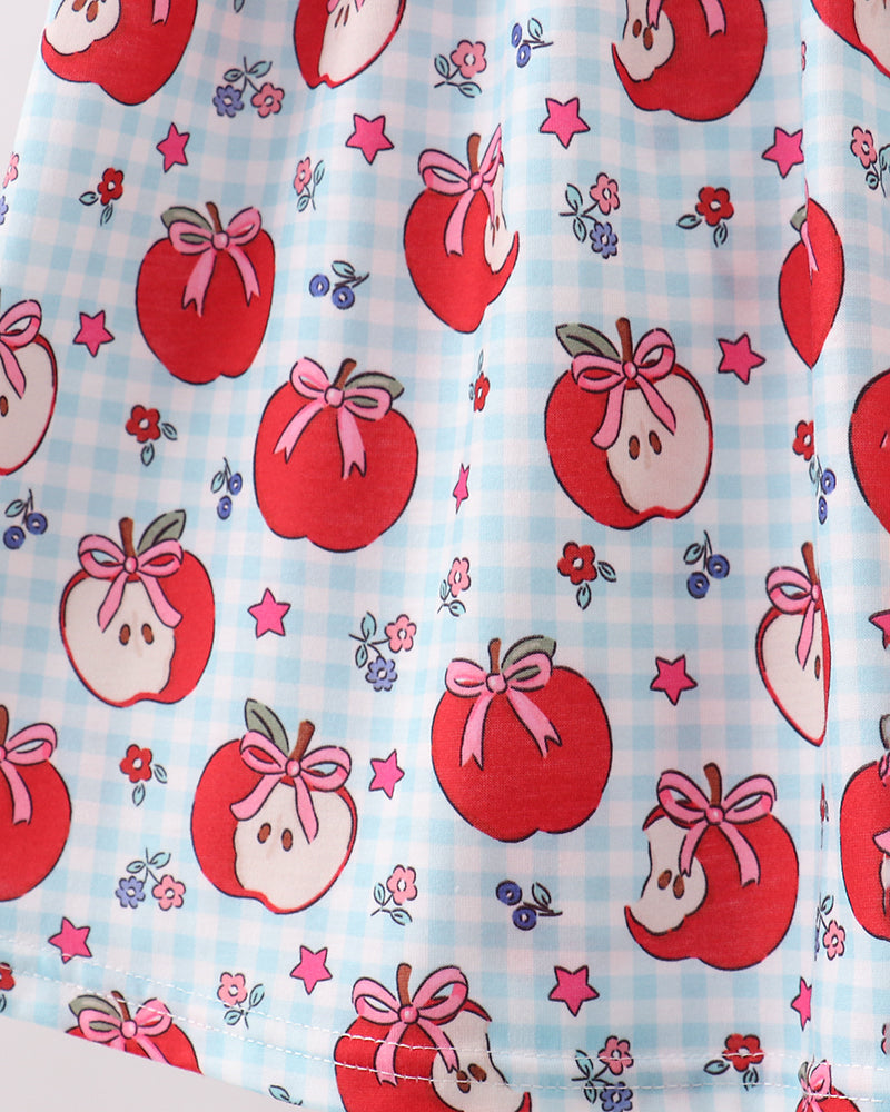 Light blue apple print fabric with red apples, bows, and small star accents