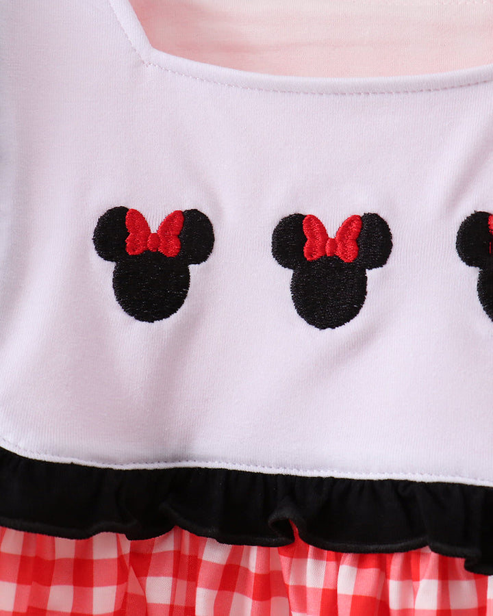 Character embroidery on white and red gingham dress