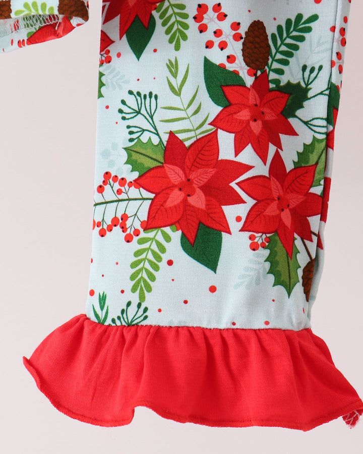 Kids pajama top detail: light blue print with red ruffled peplum hem