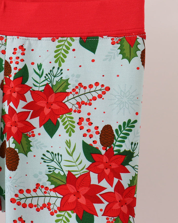 Kids pajama pants waistband and pattern: light blue with red poinsettias and berries