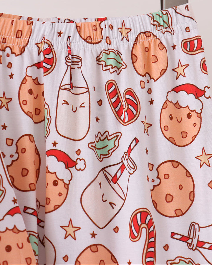 Pajama pants with elastic waistband and red-trimmed cuffs, cookie pattern