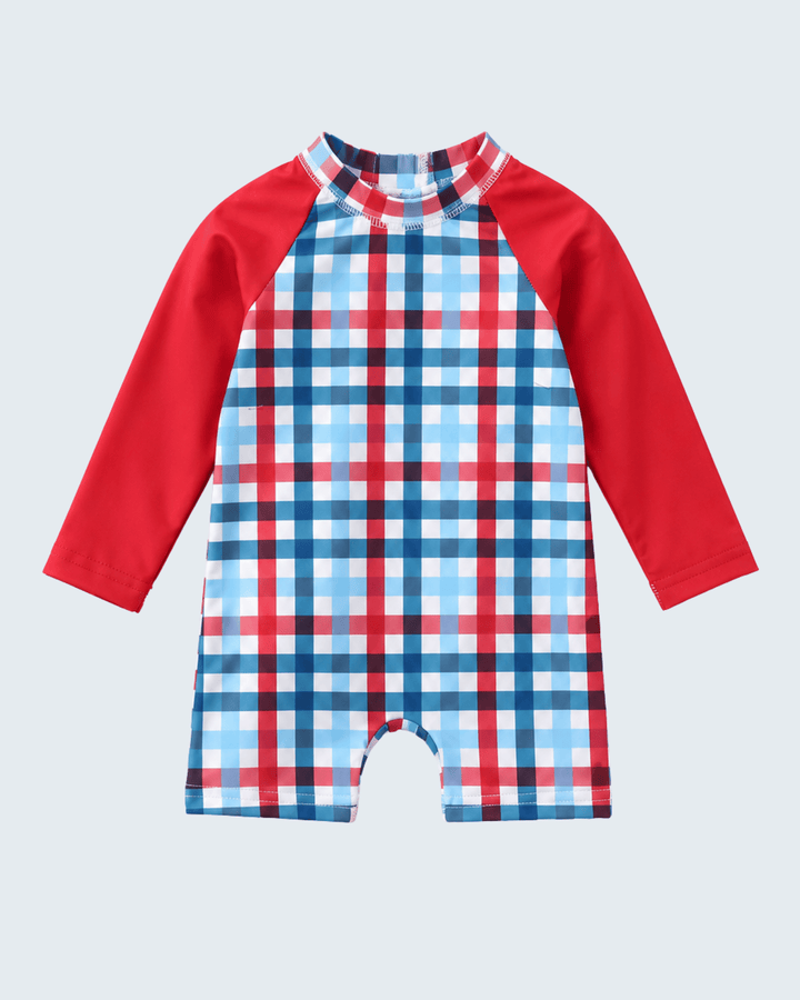 Plaid baby swimsuit with red sleeves on a light gray background