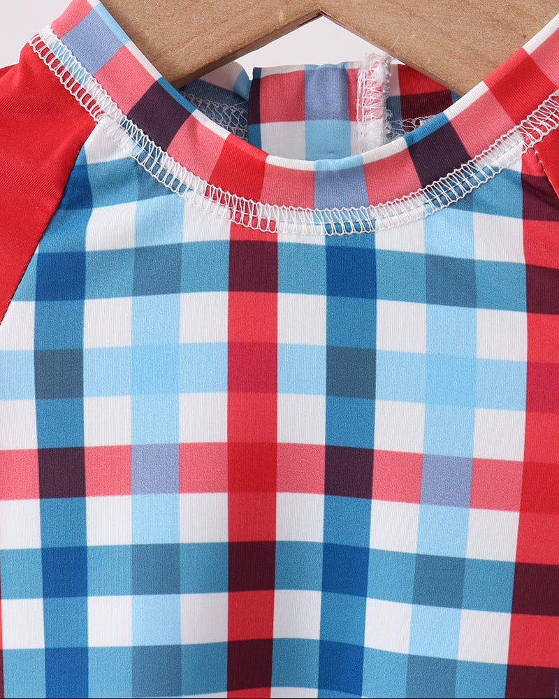 Close up of checkered swimsuit on hanger