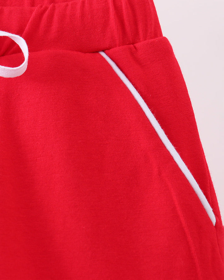 Red skort close-up of elastic waistband and side tie strings