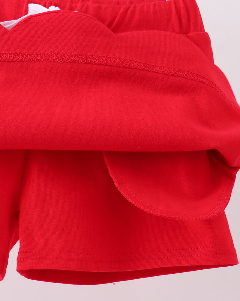 Red skort with layered look and rounded scallop hem detail