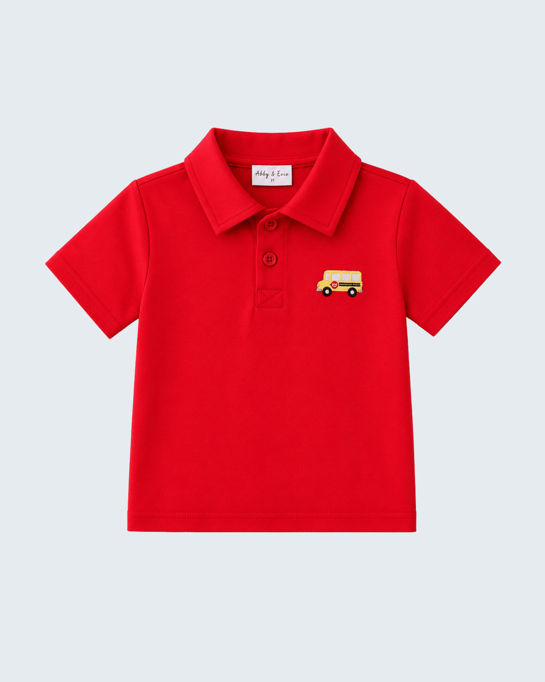 Red pocket polo shirt with school bus applique, short sleeves and button placket