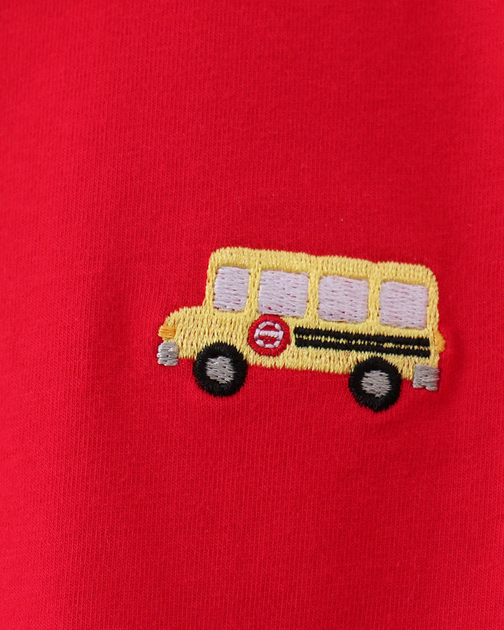 Red polo shirt with embroidered yellow school bus and round wheel detail