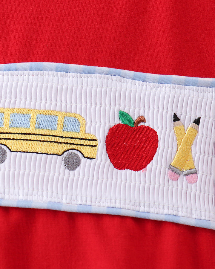 White smocked panel with school bus, apples, and crayons applique