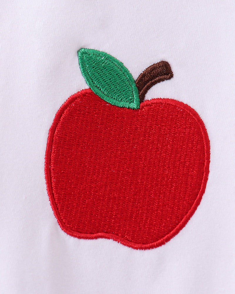 Green leaf and red apple embroidery patch on white T-shirt