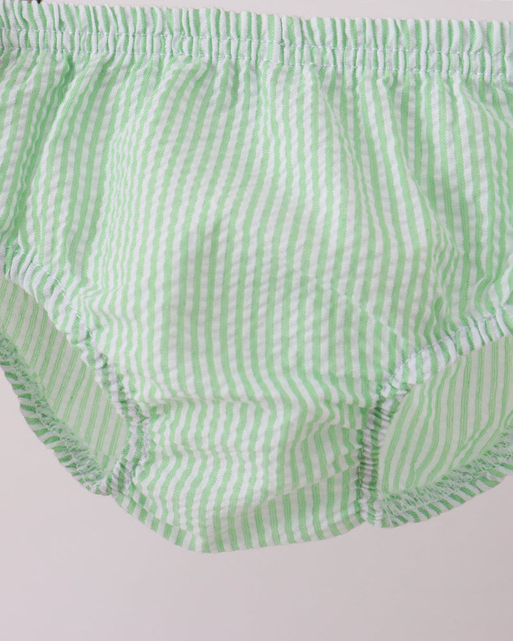 Green and white striped baby bloomers on a light gray background