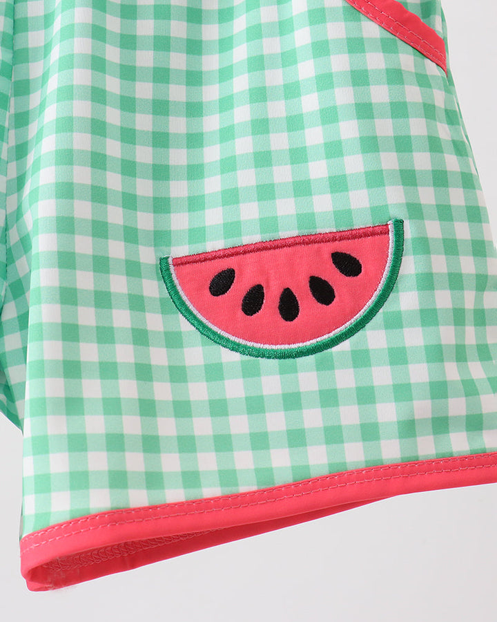 Green checkered shorts with a watermelon design on a white background
