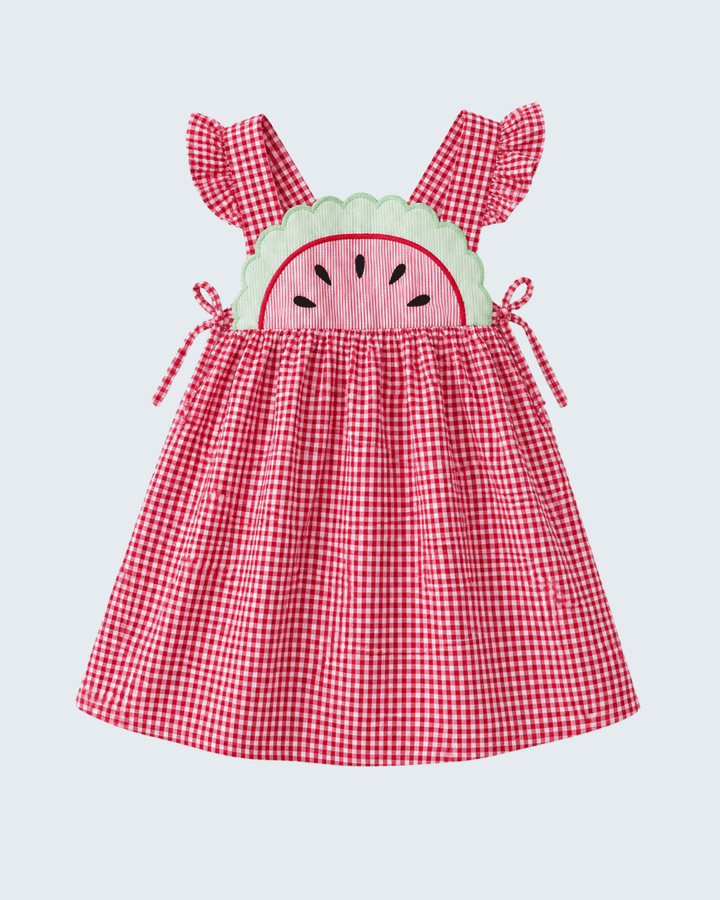 Red gingham dress with watermelon design on a light gray background
