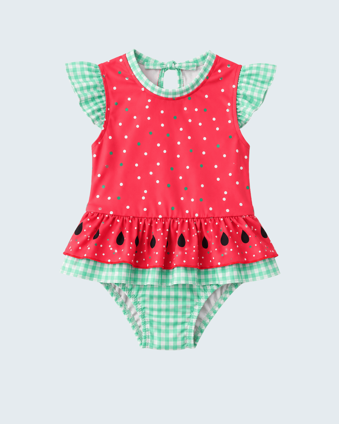 Red and green polka dot swimsuit with ruffled top and checkered bottom on a light gray background