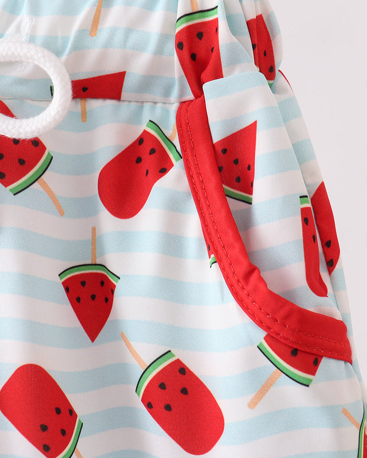 Swim trunks with watermelon print on a striped background
