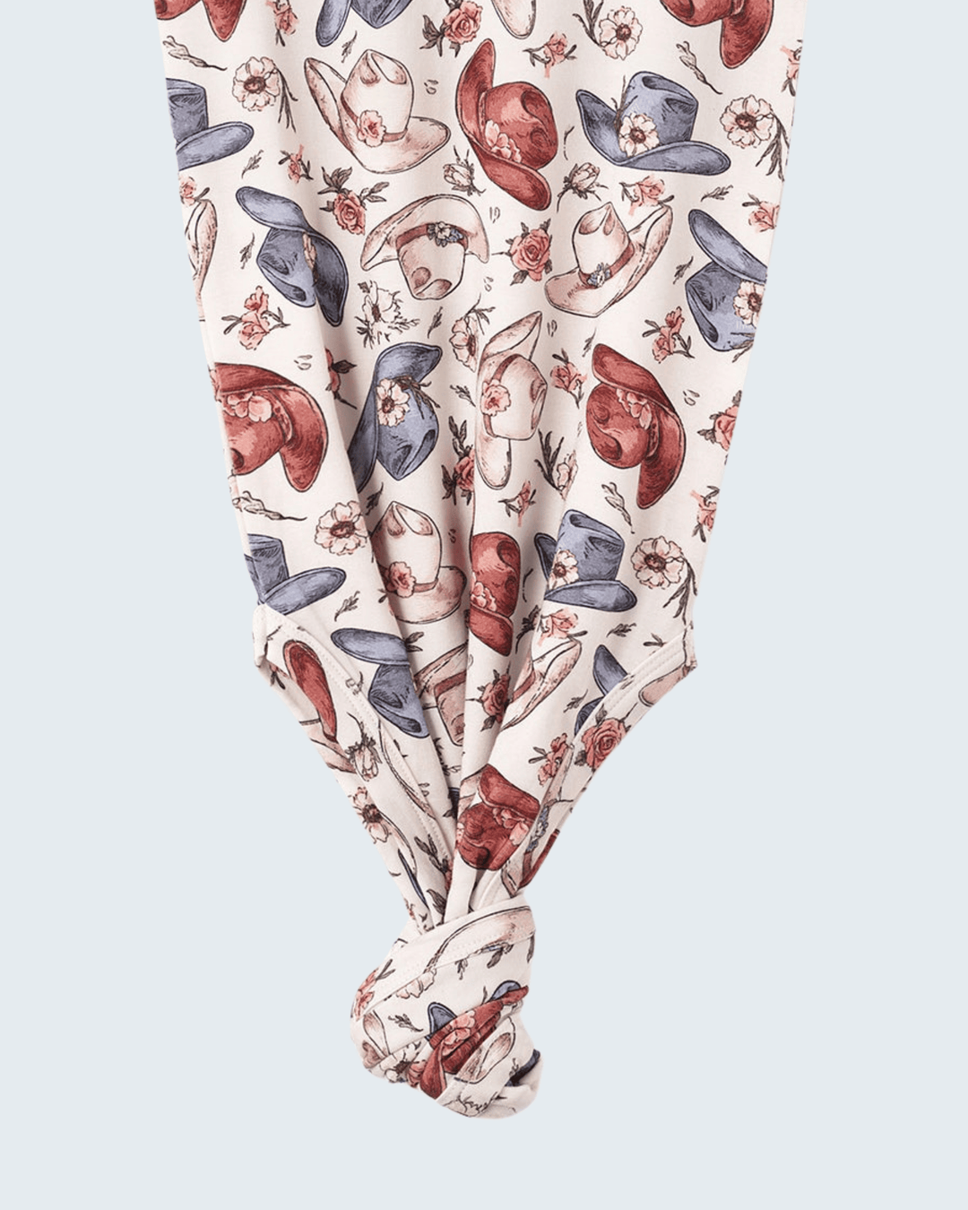 Bamboo knot gown detail: allover cowgirl hat and boot print with knotted front hem
