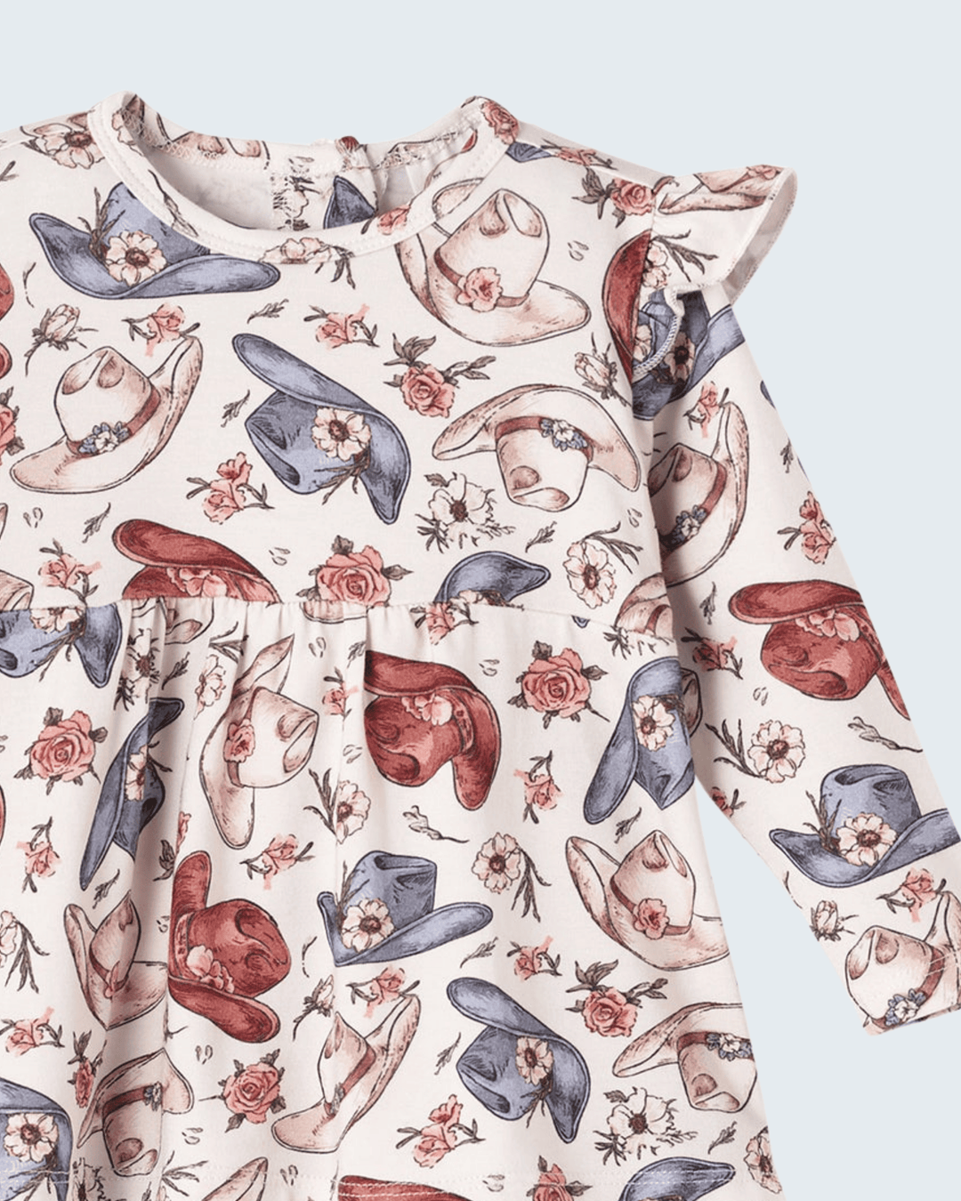 Bamboo cowgirl top close-up with rodeo-themed print and ruffled crew neckline