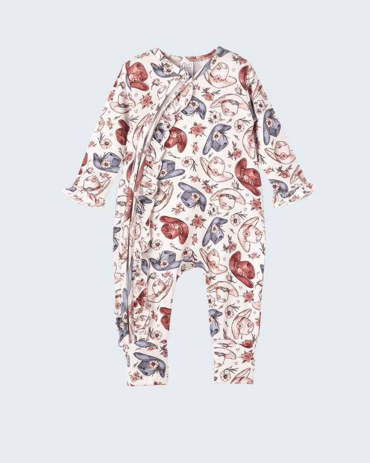 Bamboo zipper romper with allover cowboy boot, hat, and feather print, long sleeves