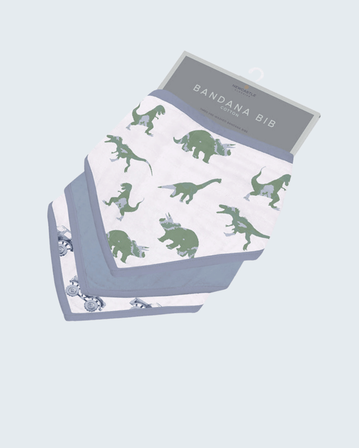 Bandana bib with green dinosaur pattern on a light blue background
