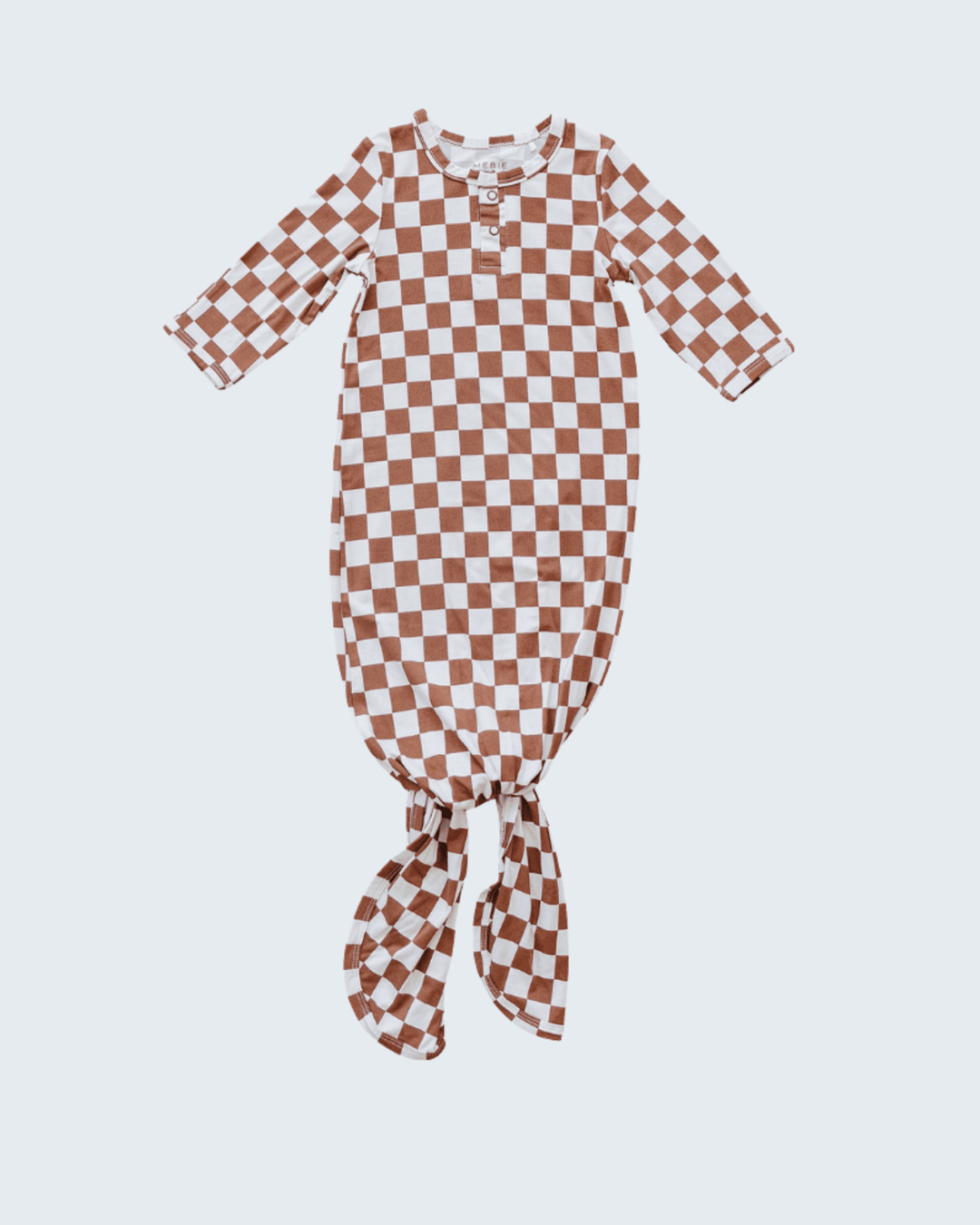 Checkered baby gown on a light gray background