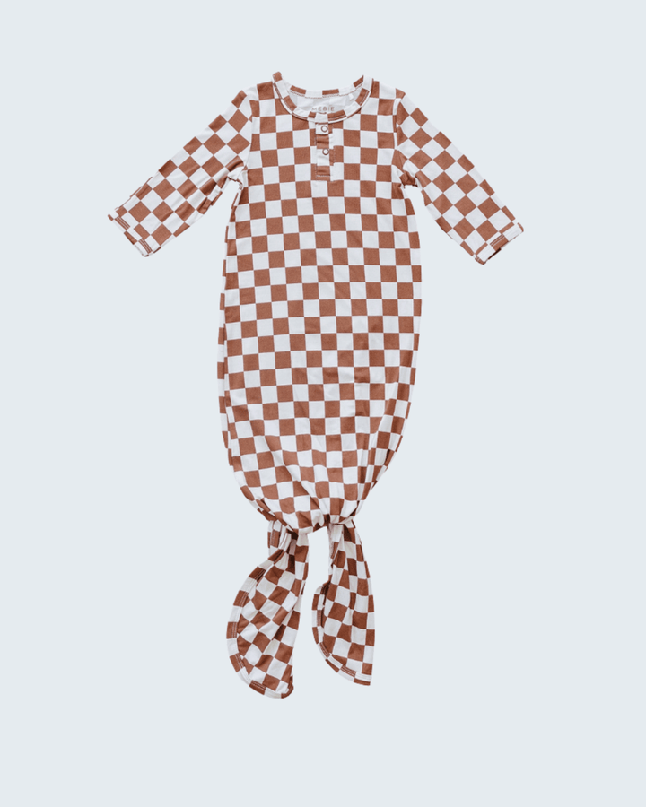 Checkered baby gown on a light gray background