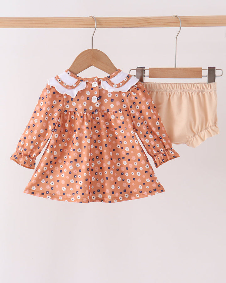 Rust floral long-sleeve dress with white Peter Pan collar and matching cream bloomer shorts