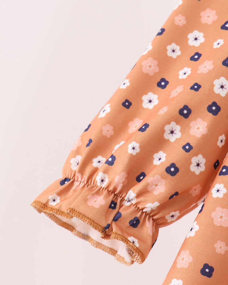 Rust floral long sleeve with elastic cuff and gathered ruffle hem