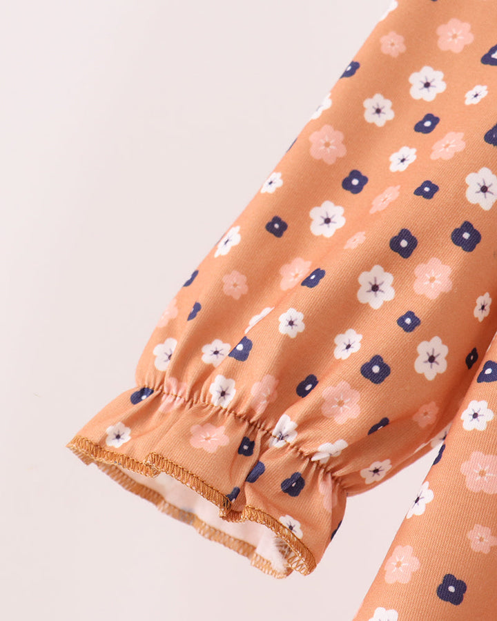 Rust floral long sleeve with elastic cuff and gathered ruffle hem