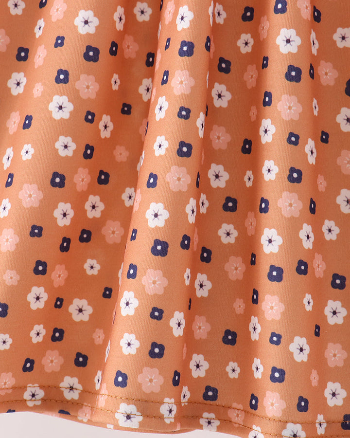 Rust floral dress panel with navy and white flower print and gathered waist