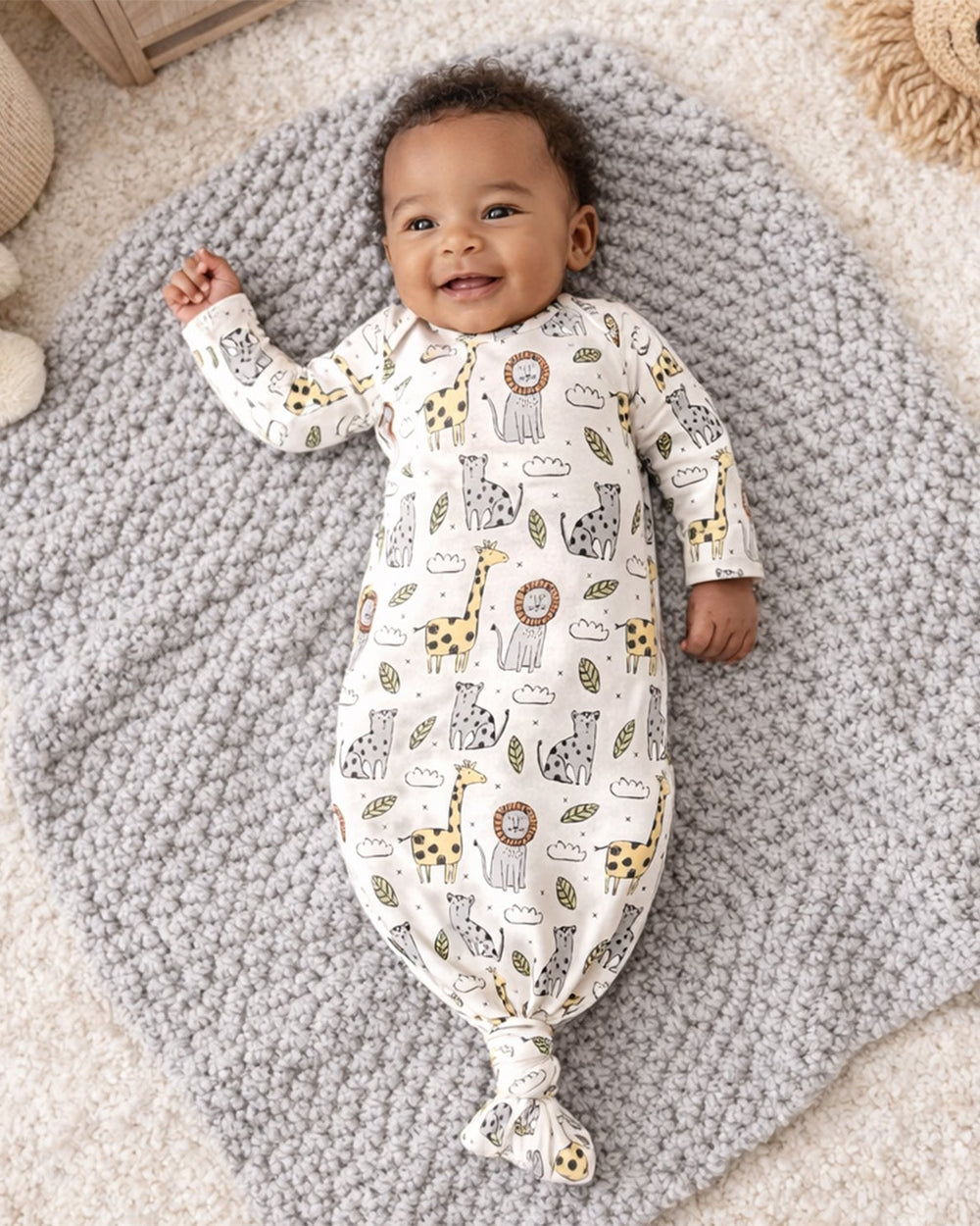 Bamboo baby knotted gown with safari animal print, long sleeves and knot at hem