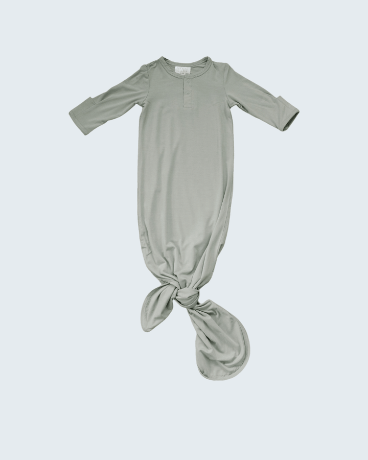 Green baby knot gown on a white background