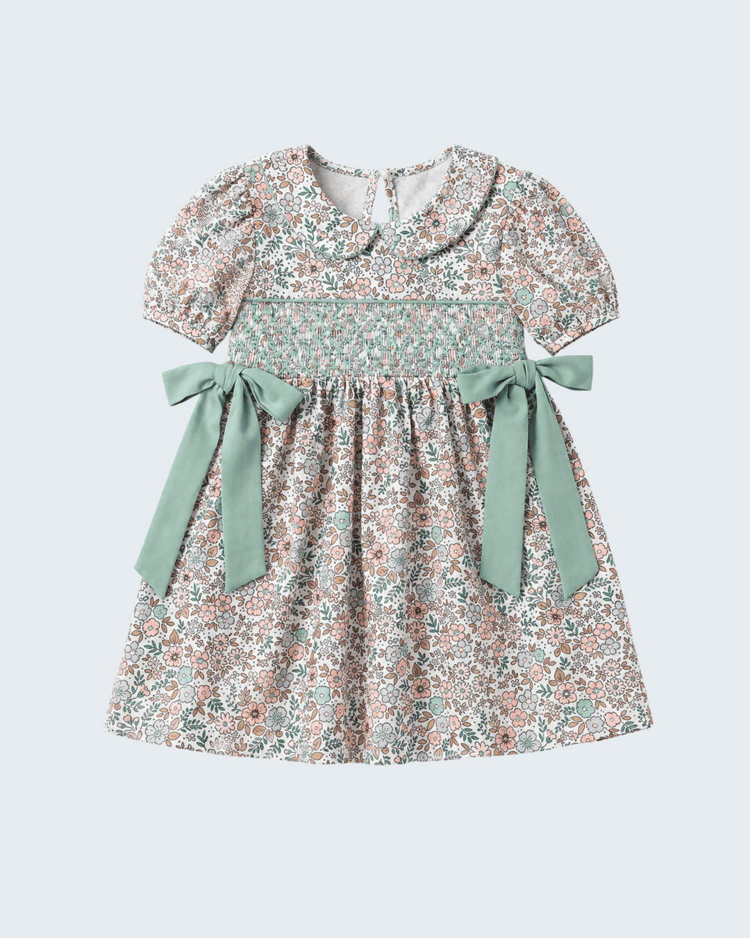 Floral smocked dress with sage bows, short puff sleeves, and gathered skirt